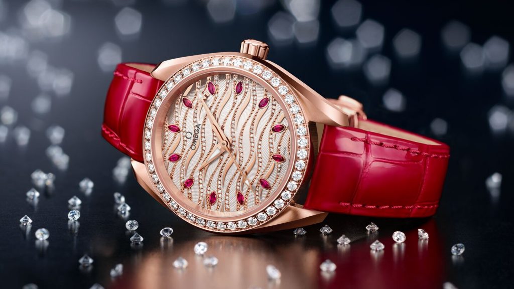 The red strap fake watch is decorated with diamonds.